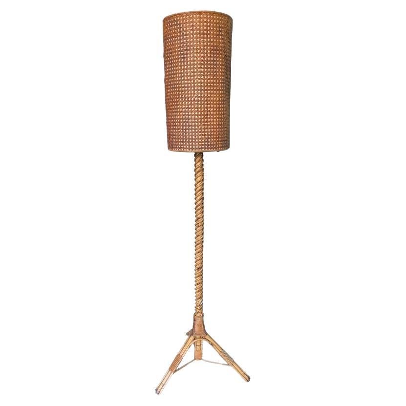 A wonderful French 1960s bamboo floor lamp by Louis Sognot with original shade For Sale