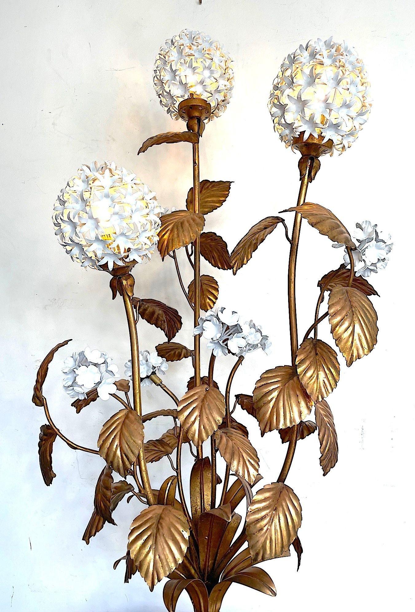 A wonderful Italain 1960s gilt metal Hydrangea floor lamp with white enamel flowers, the three larger flowers each have a light fitting, surrounded by smaller enamel flowers and gilt leaves. Re wired with new brass fittings, antique gold flex, foot