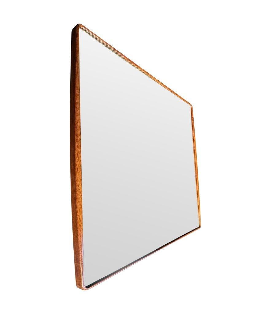 A wonderful quality, large Italian 1950s mirror by Ico Parisi with thick curved walnut frame, orignal mirror plate and solid wood back.