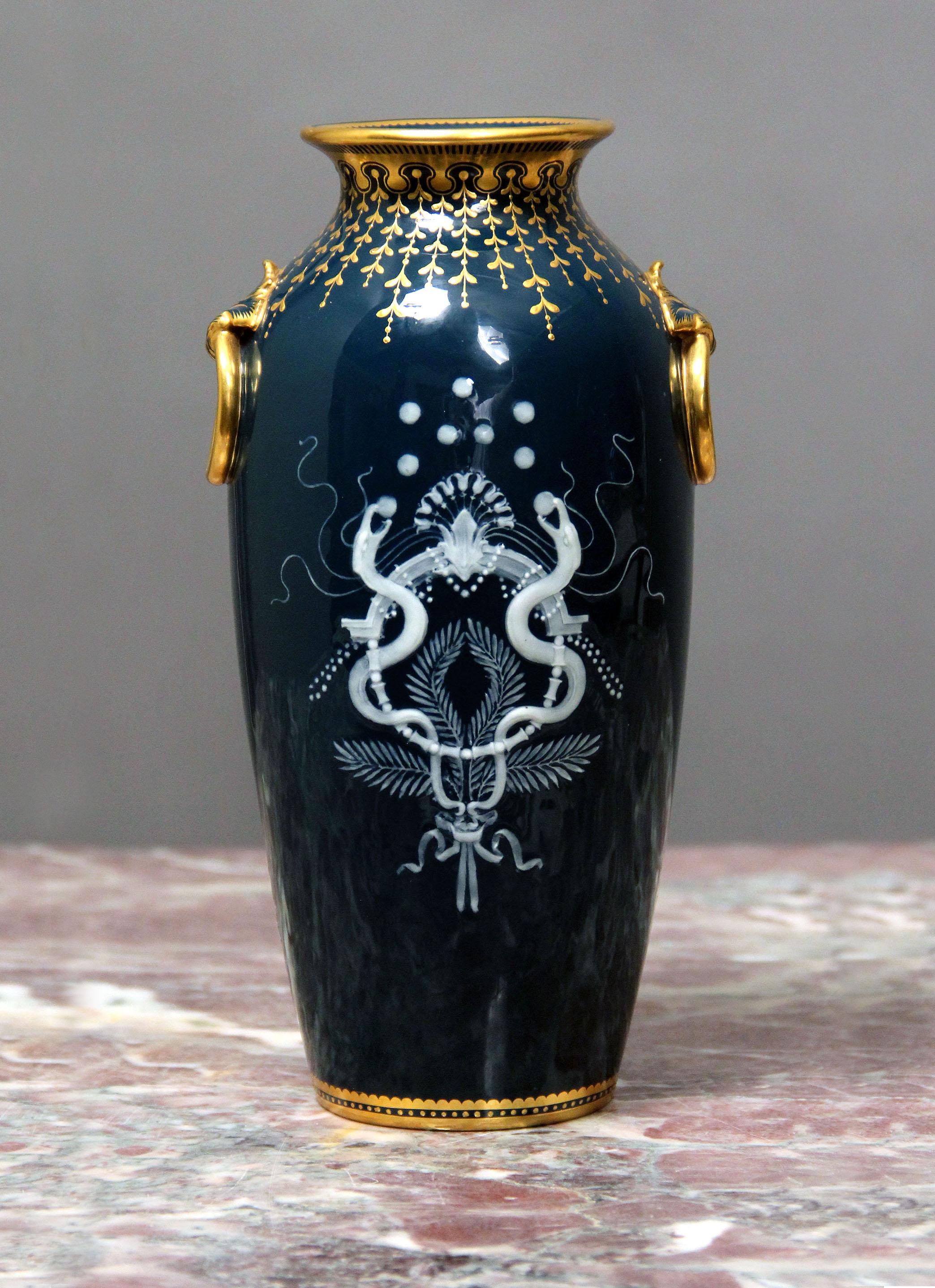 A wonderful late 19th century Minton Pâte-Sur-Pâte vase

Louis Solon

The front with an angel playing with hearts and the back with two serpents.

Signed L. Solon to the front and stamped Minton on the bottom.

Louis Marc Emmanuel Solon