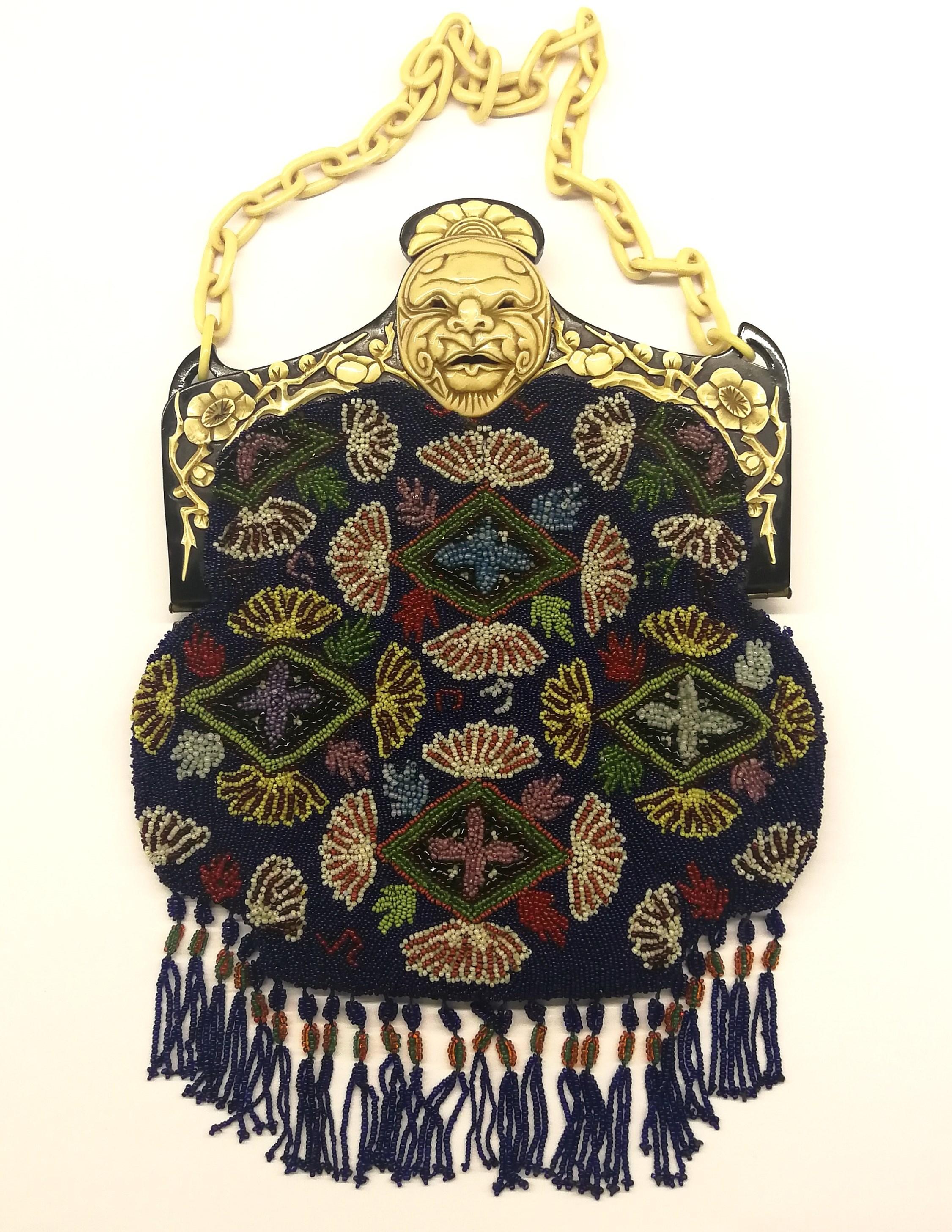 Black A wonderful micro beaded handbag, with an Oriental mask frame, France, 1920s