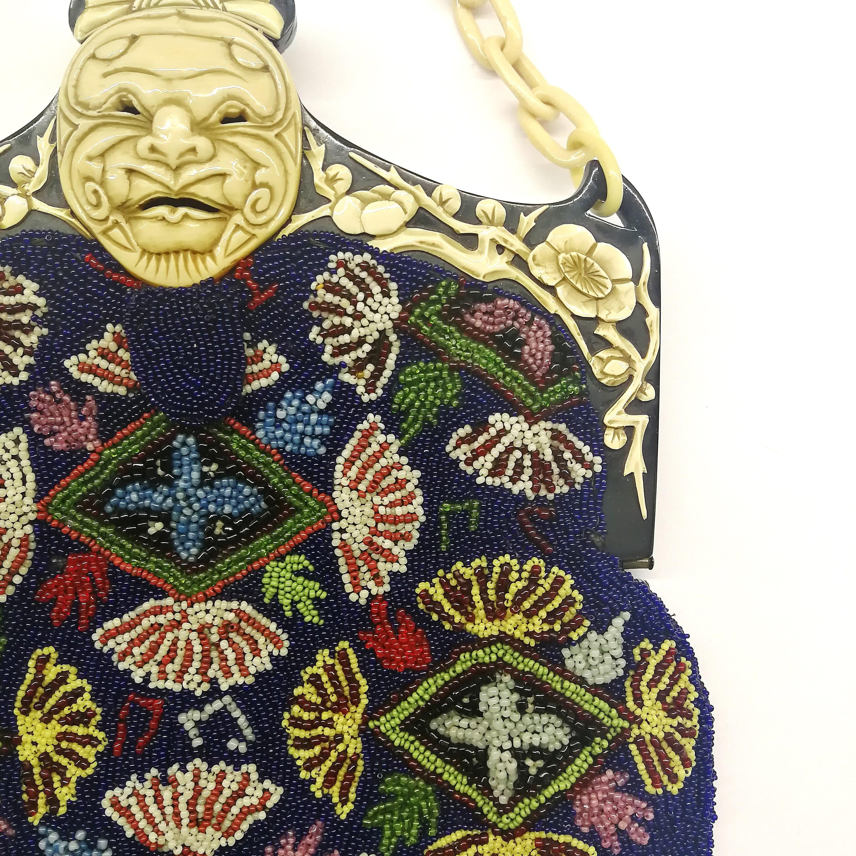 Women's A wonderful micro beaded handbag, with an Oriental mask frame, France, 1920s
