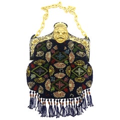 Antique A wonderful micro beaded handbag, with an Oriental mask frame, France, 1920s