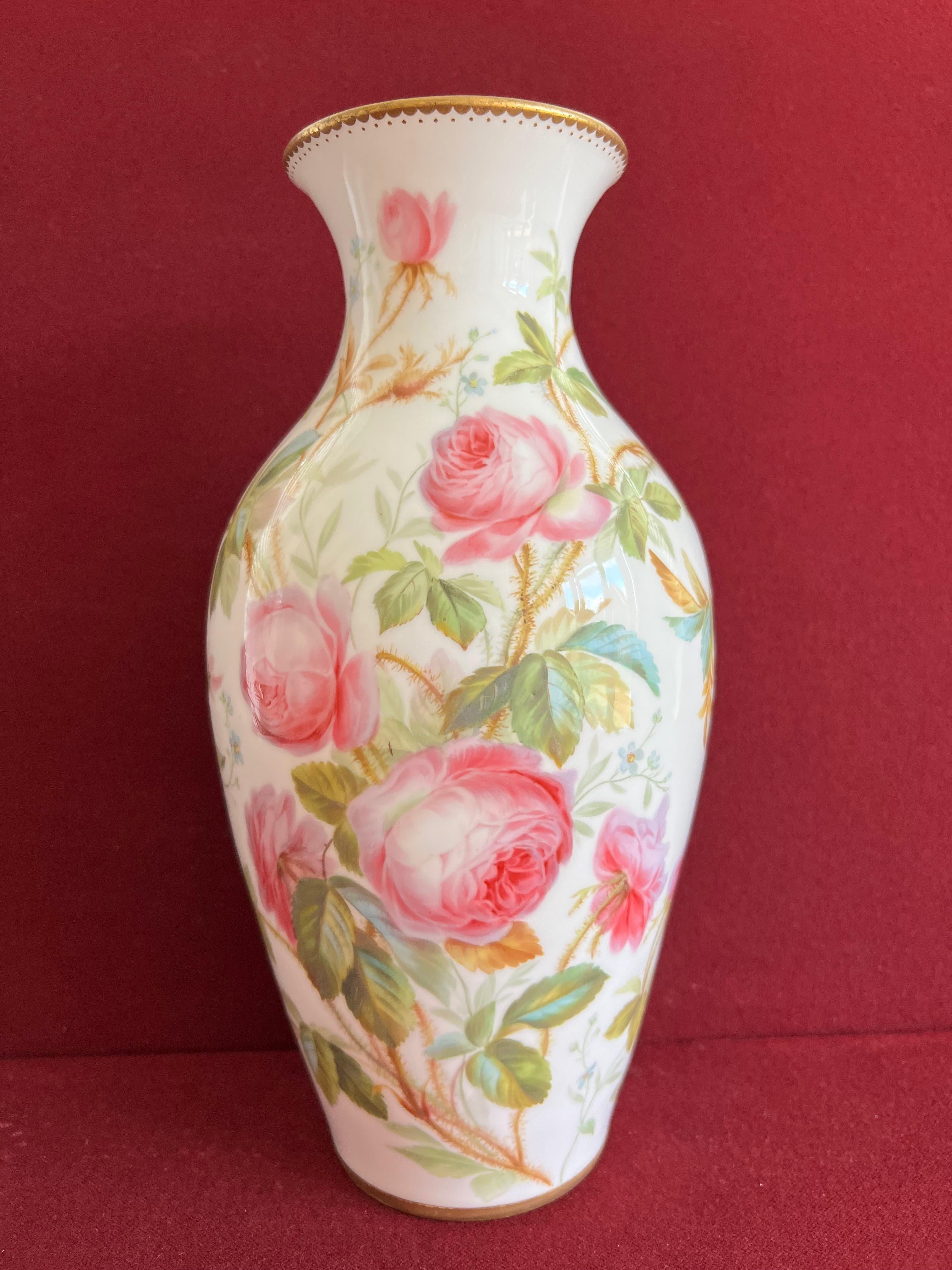A wonderful Minton bone china vase c.1850. Superbly painted round the body with studies of roses in the manner of Jessie Smith. Small ermine-device mark. 29 cm high

Jessie Smith was apprenticed at the Minton Pottery in c.1831 and became known for