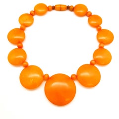 A wonderful orange resin necklace, bangle and ring , Marion Godart, Paris, 1990s