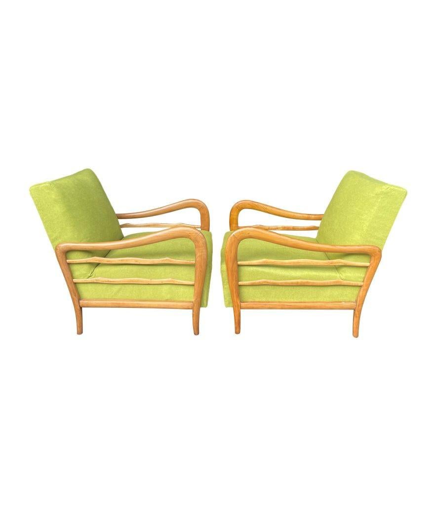A wonderful pair of 1950s Italian Cherrywood chairs by Paolo Buffa with sculptural curved arms and upholstered in acid green fabric.