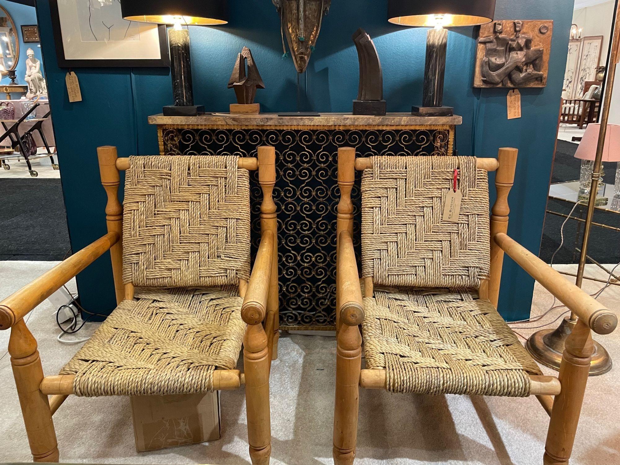 A wonderful pair of 1950s armchairs by Adrien Audoux and Frida Minet with primitive style hand turned beech wood frames and orignal handwoven abaca rope seats and backs, all in perfect original condition. these beautifully designed iconic chairs are