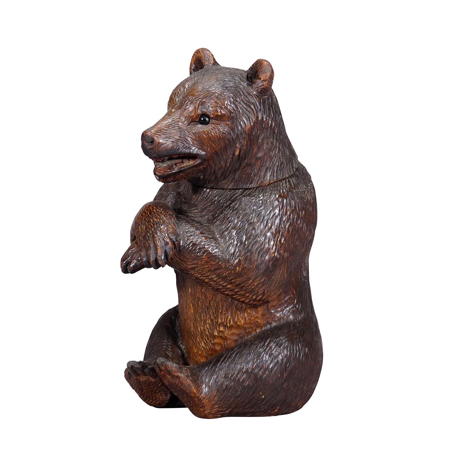 A Wooden Carved Black Forest Bear Humidor ca. 1900s
Item e7261
Large Black Forest humidor in the shape of a bear with a clip-on head. Executed in Brienz, Swizerland around 1900. Very good condition.

The tradition of wood carving, using manual