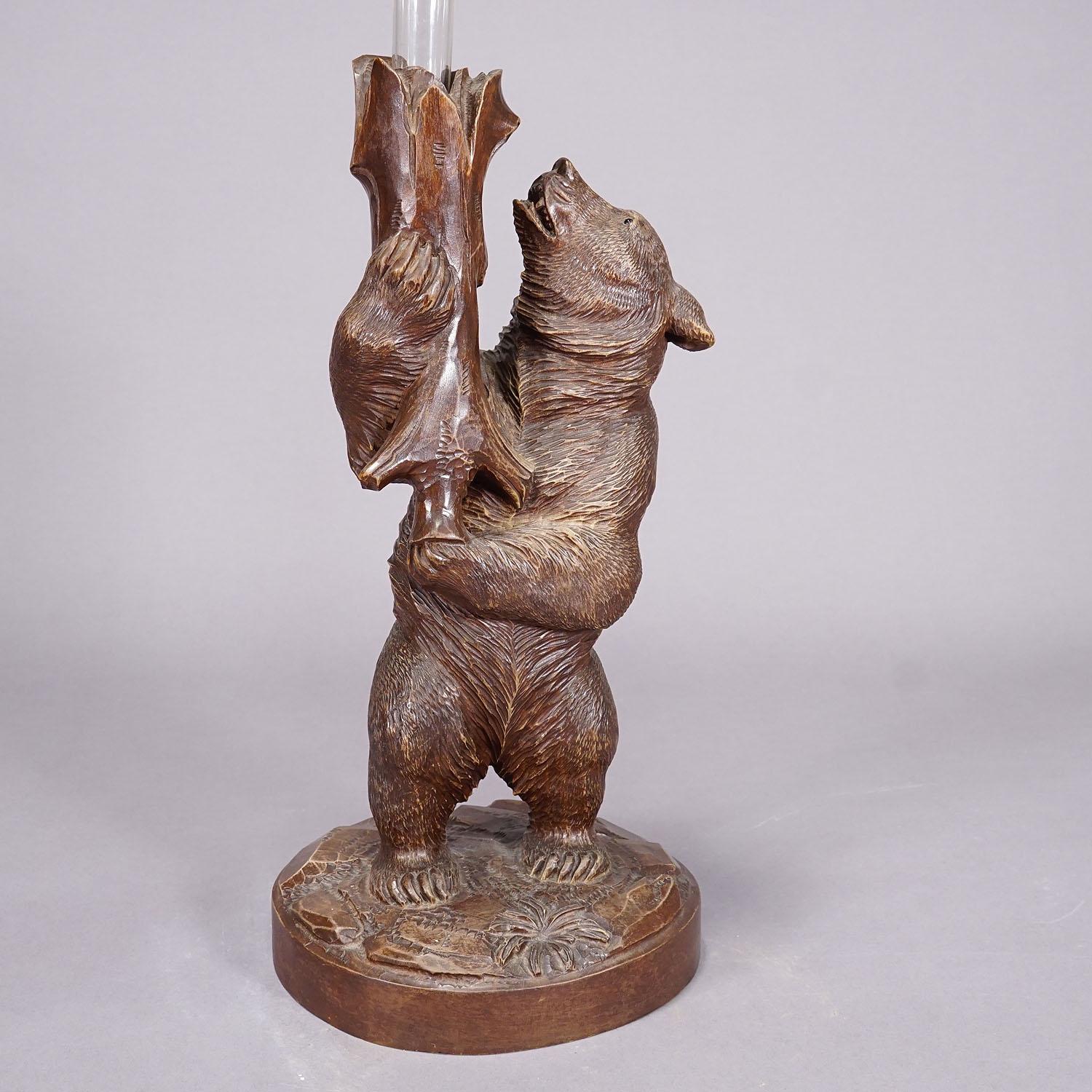 Swiss A Wooden Carved Black Forest Bear with Glass Vase ca. 1900s For Sale