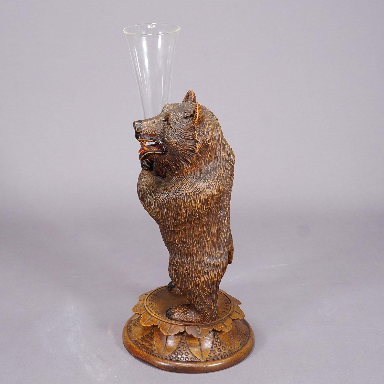 Swiss A Wooden Carved Black Forest Bear with Glass Vase ca. 1920 For Sale