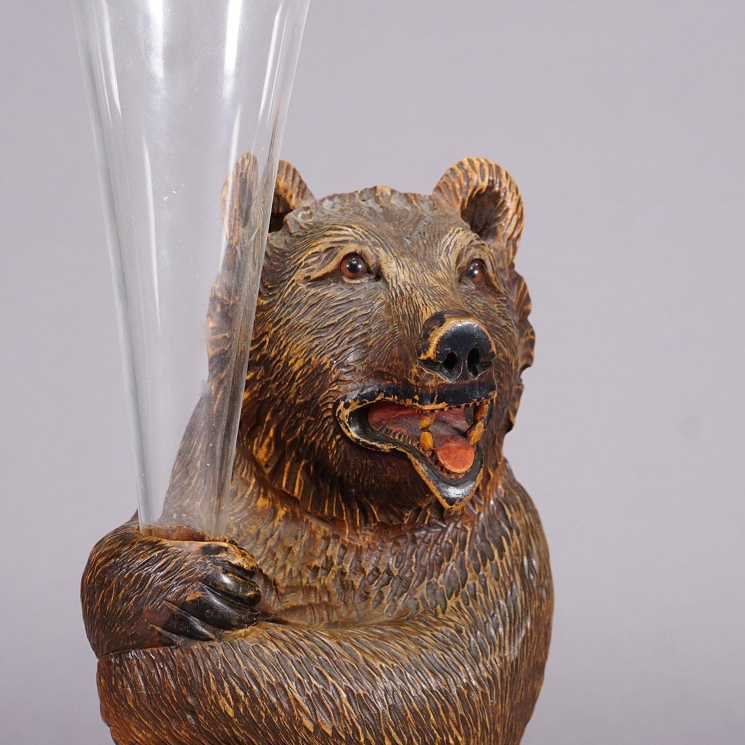 20th Century A Wooden Carved Black Forest Bear with Glass Vase ca. 1920 For Sale