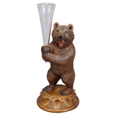 A Wooden Carved Black Forest Bear with Glass Vase ca. 1920