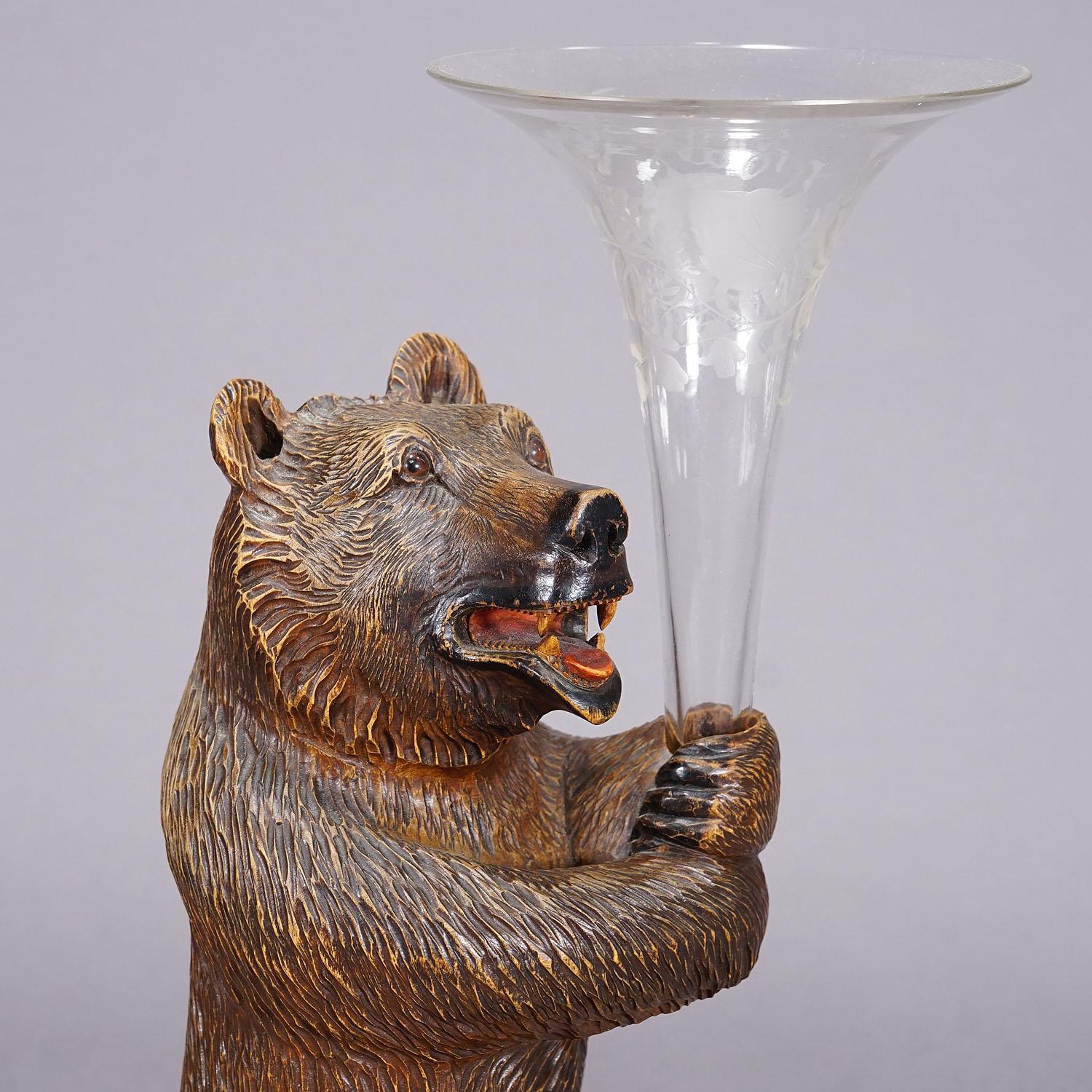 Swiss A Wooden Carved Black Forest Bear with Glass Vase For Sale