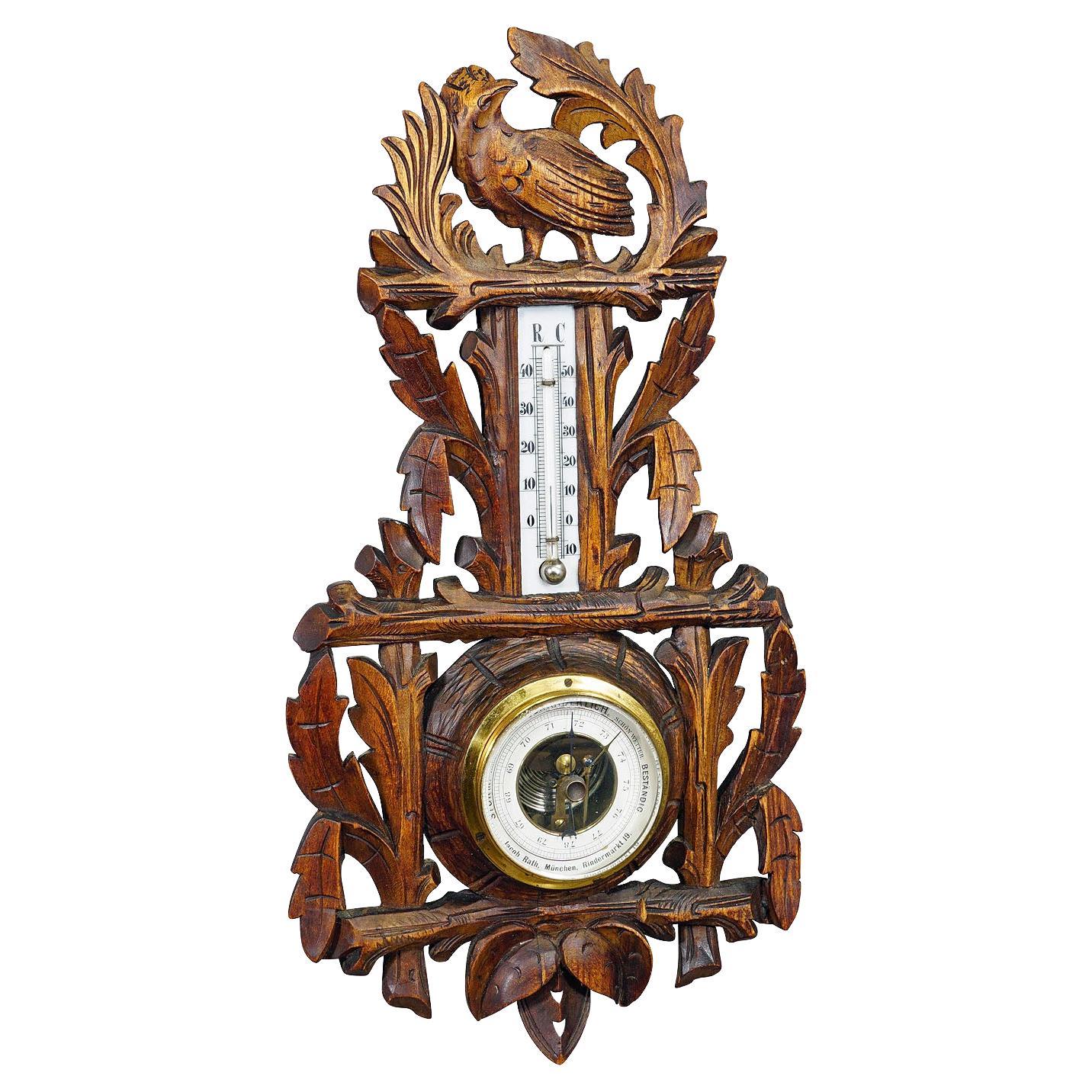 A Wooden Carved Black Forest Weather Station with Bird For Sale