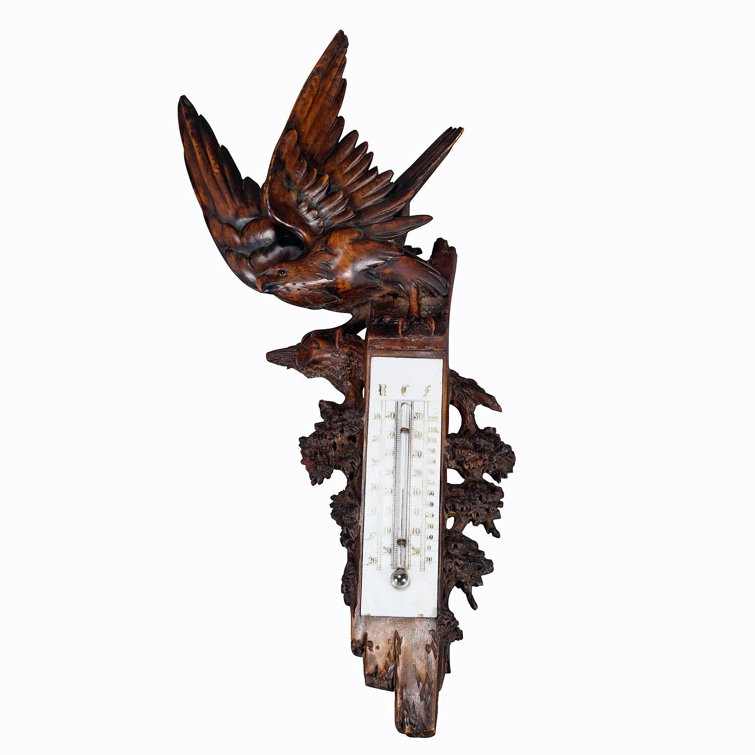 A Wooden Carved Black Forest Weather Station with Eagle
Item e7258
A large Black Forest meteorological station with thermometer. Handcarved with an impressive carved eagle on top and decorated with elaborate foliage carvings. Executed in Brienz,