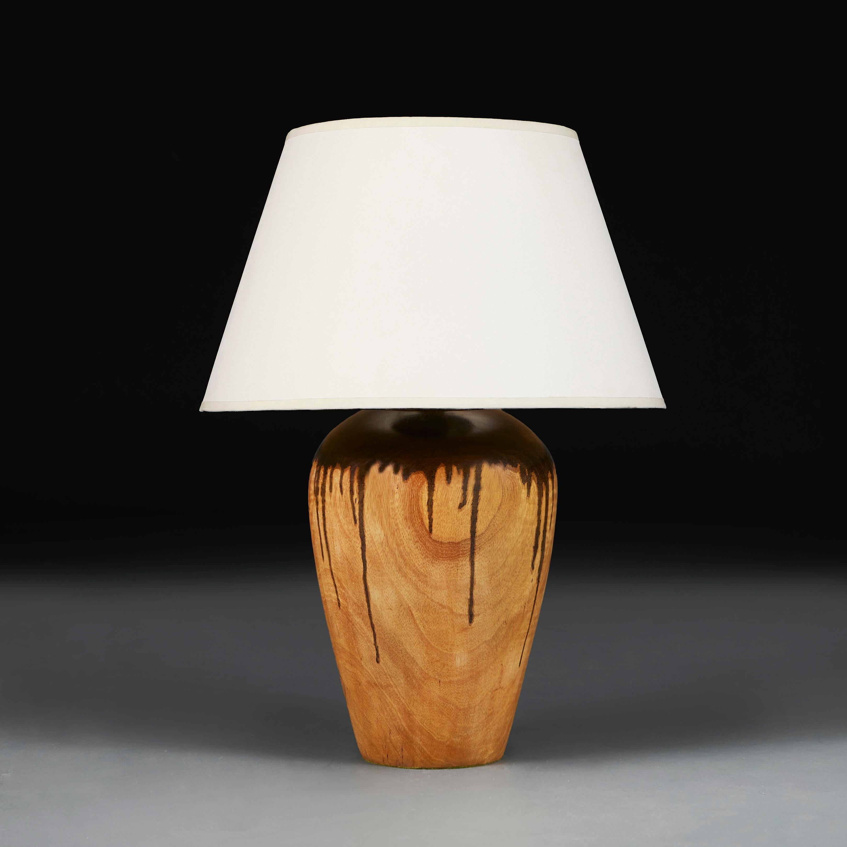 England, circa 1960

A turned beech wood vase with dark drip stain applied round the rim, now converted as a lamp. 

Height of vase 32.00cm

Diameter of base 13.00cm

Photographed with a 16” diameter Pembroke card lampshade.

Please note: This is