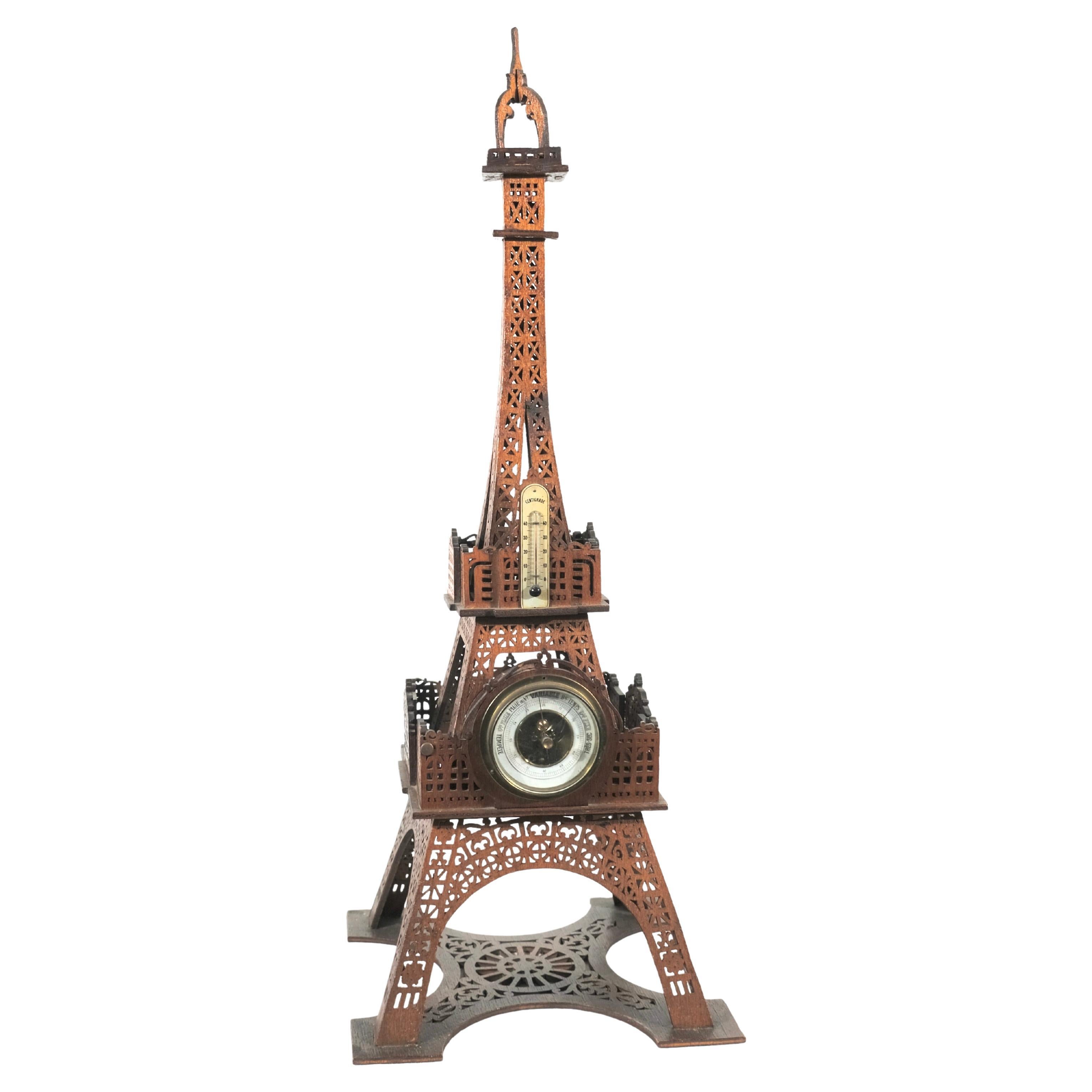 A wooden Eiffel Tower with a barometer and a thermometer, late 19th c.