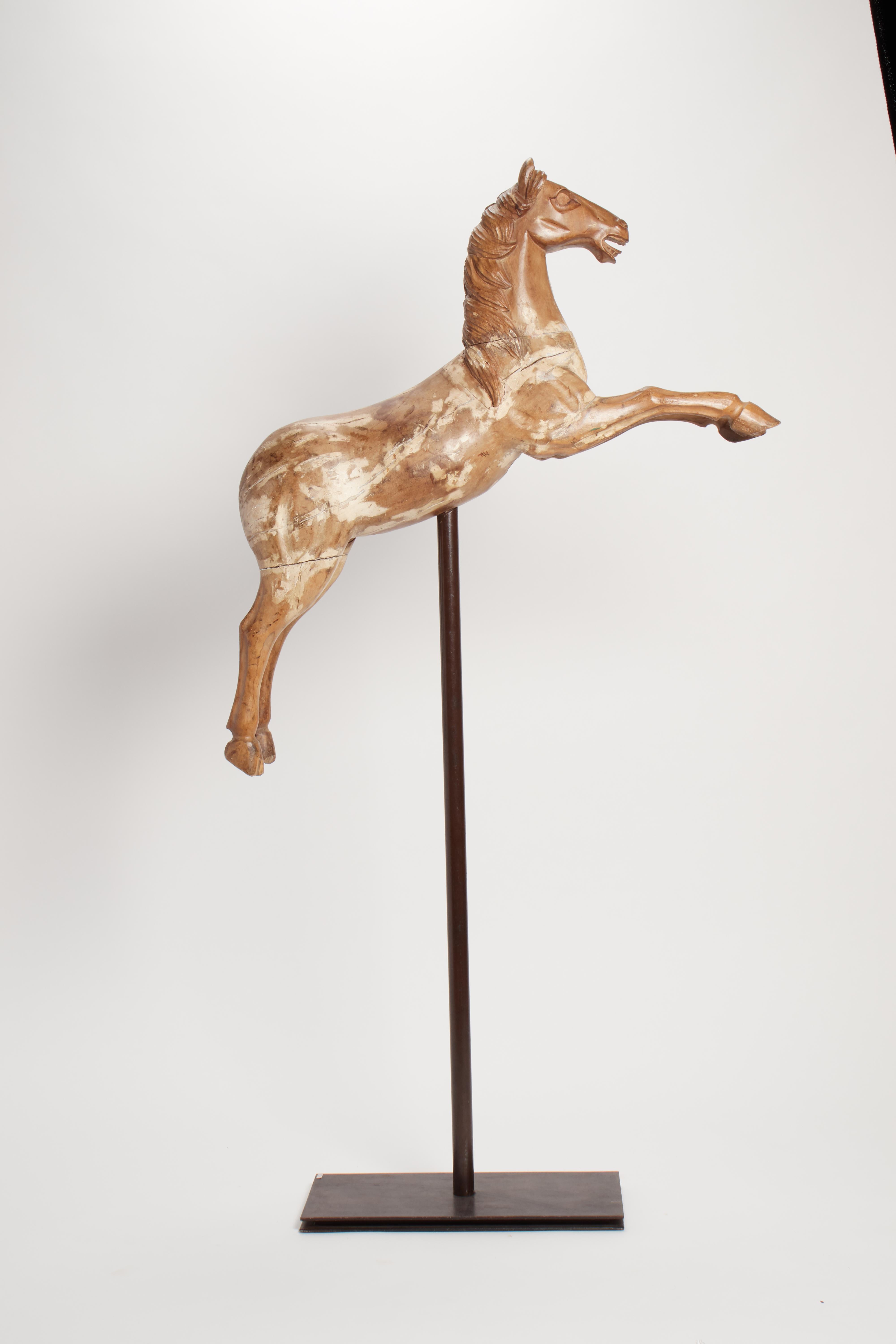 18th Century A wooden sculpture depicting a prancing carousel horse, Italy 1750. For Sale