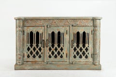 A Wooden Sideboard with Wooden Openwork Doors