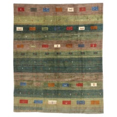 A Woodland Reverie: Vintage Persian Gabbeh of Verdant Harmony 
Artisanal Grace