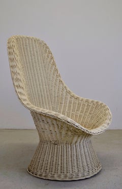 A woven rattan armchair, white lacquered - France - 1960.