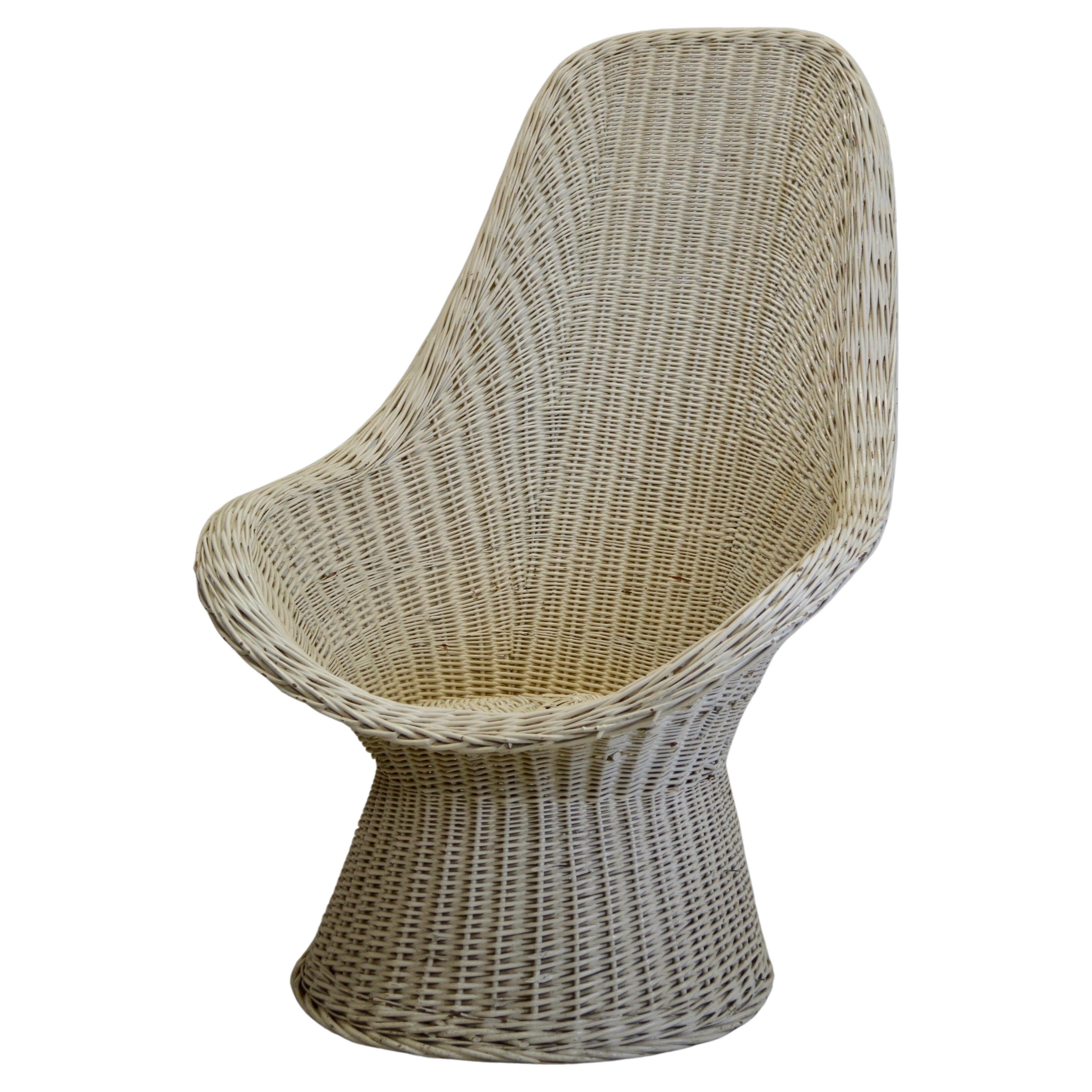 A woven rattan armchair, white lacquered - France - 1960.