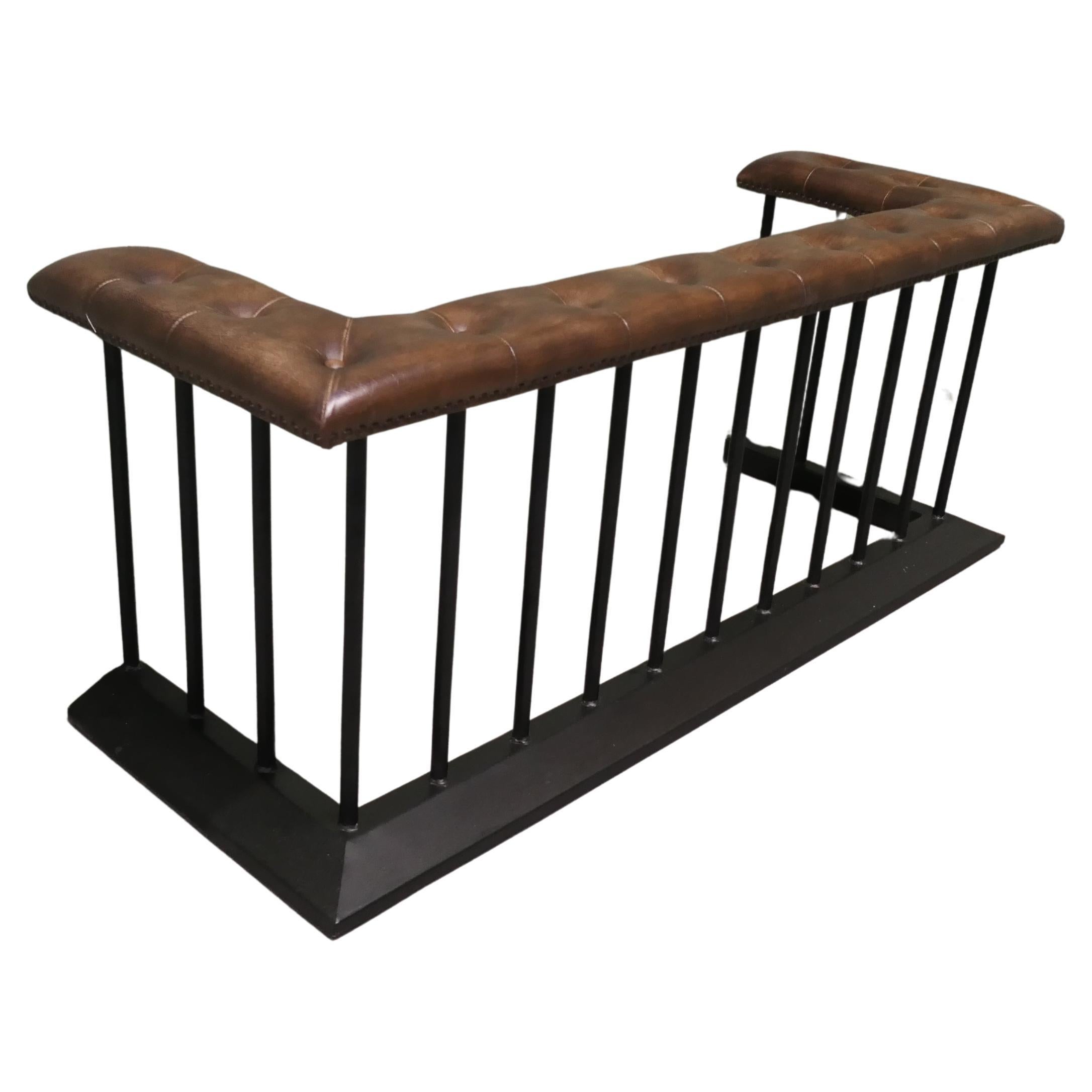 A Wrought Iron and Leather Fire Side Seat, Club Fender This is a grand piece