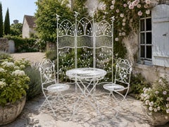 A Wrought-iron Dining Set with Screen and Bird and Branch Motif
