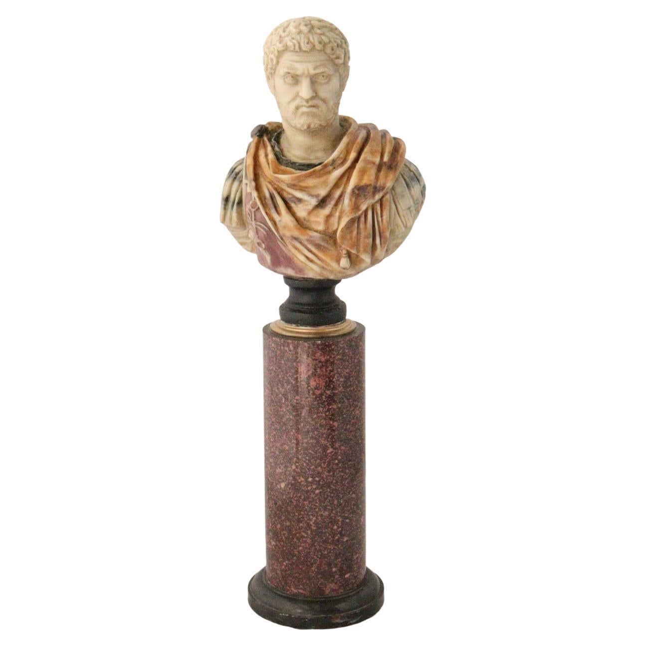 A XIXth century grand tour bust of caracalla and its porphyry column.
Bust of the Roman Emperor Caracalla in Polychromed resin simulating different colors of marbles, resting on its circular red porphyry and black marble column.
Italy
Circa
