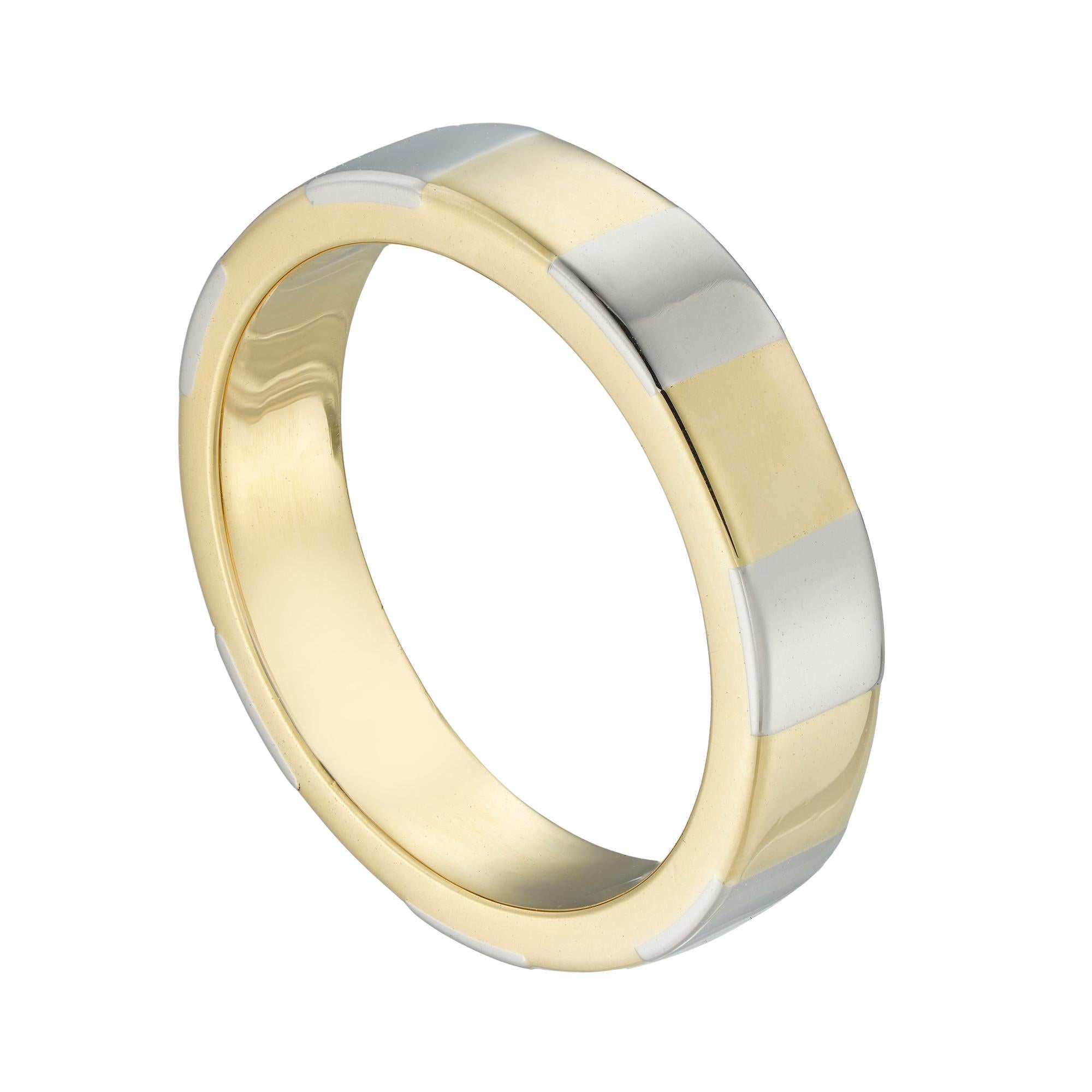 A yellow and white gold ring, the parallel rounded-section yellow gold band, with seven white gold stripes, circa 2000, later hallmarked 18ct gold, London, bearing the Bentley & Skinner sponsormark, measuring 1.9 x 0.4cm, finger size J, gross weight