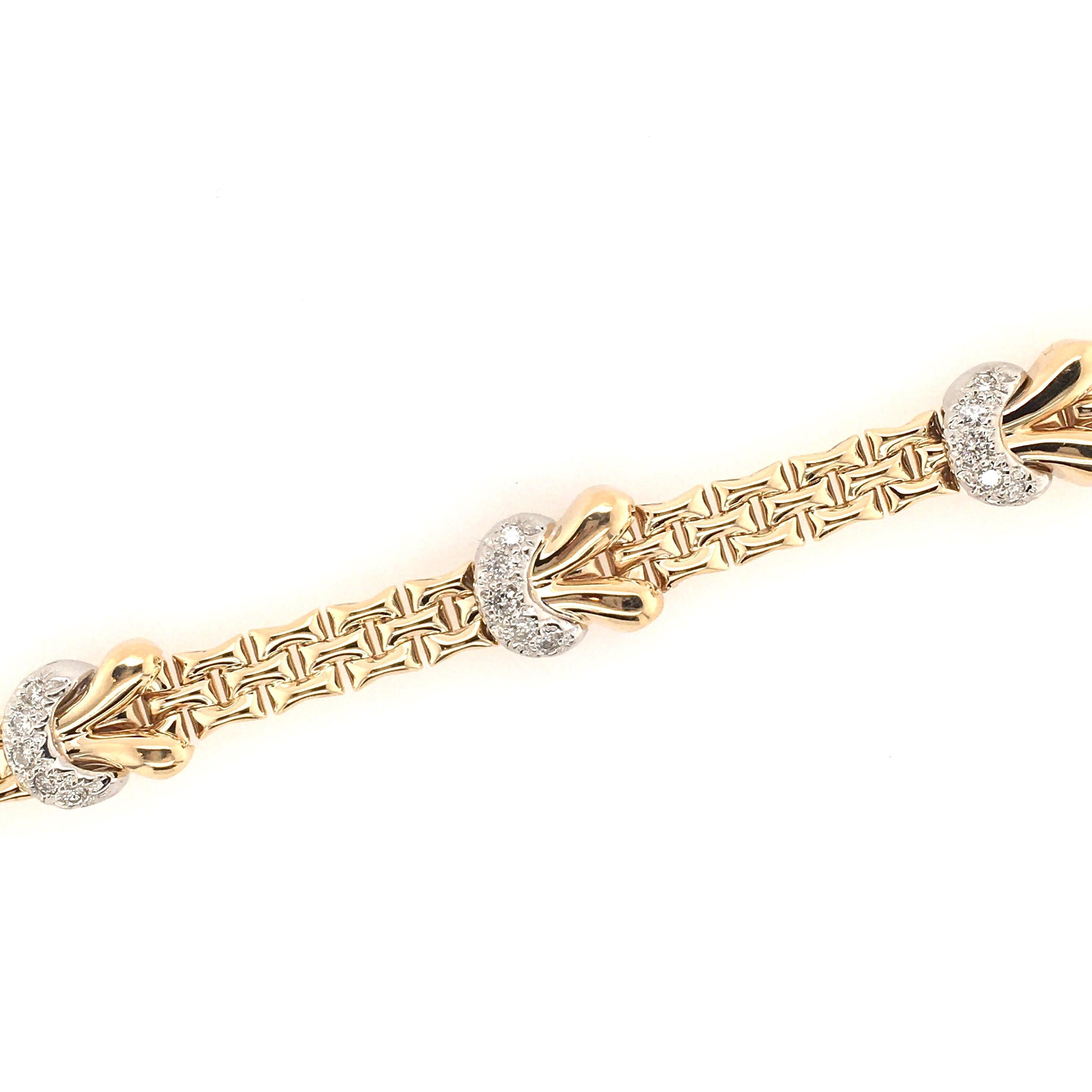 A 14 karat yellow gold and diamond bracelet.  Designed as polished fancy links, enhanced by four (4) pave set diamond half moon shaped links. Twenty (20) diamonds weigh approximately 0.80 carat. Length is approximately 7 inches, gross weight is