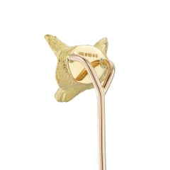 A yellow gold and diamond fox-head stick pin