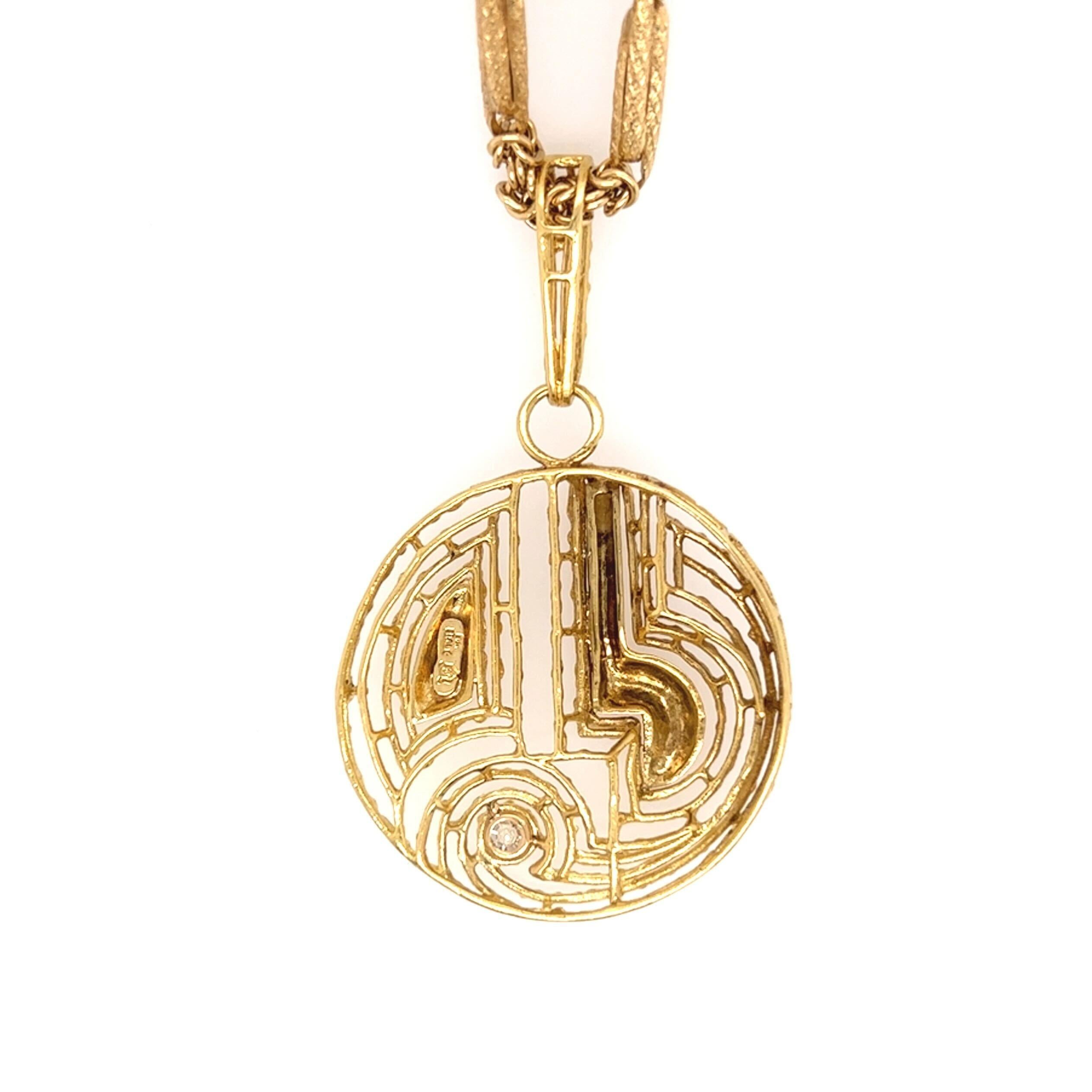 Round Cut A Yellow Gold and Diamond Pendant Necklace.