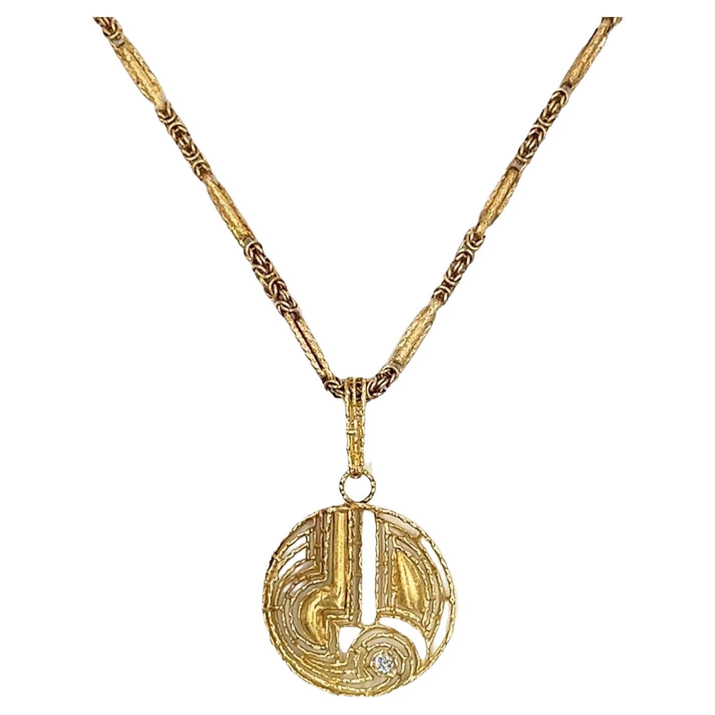 A Yellow Gold and Diamond Pendant Necklace.