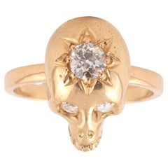 A Yellow Gold And Diamond Skull Ring