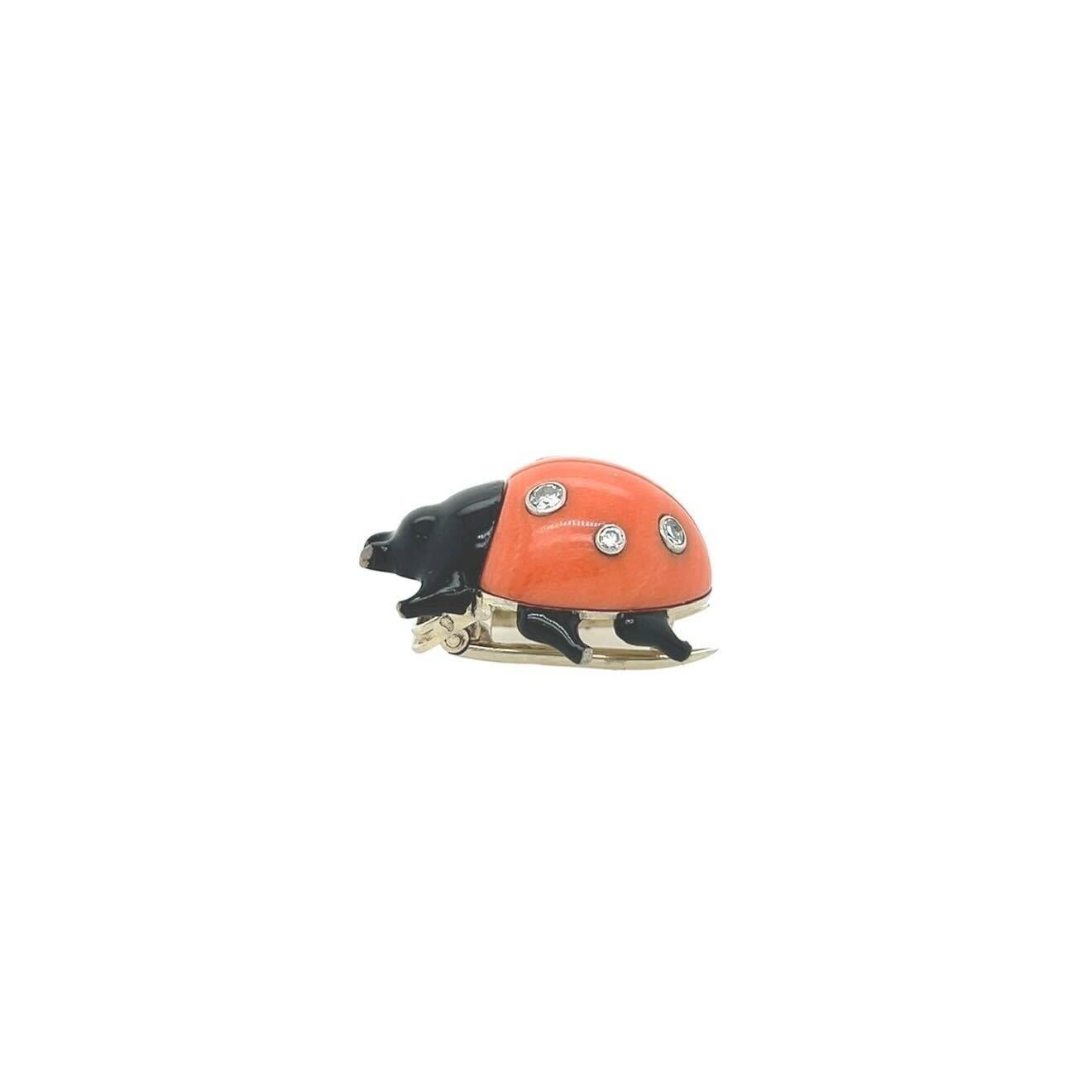  - An 18 karat white gold, black lacquer, diamond and coral ladybug brooch, Cartier, French, circa 1935. Set with six (6) single cut diamonds. Length approximately 7/8 inches. Gross weight approximately 8.5 grams. With maker’s marks for Cartier,