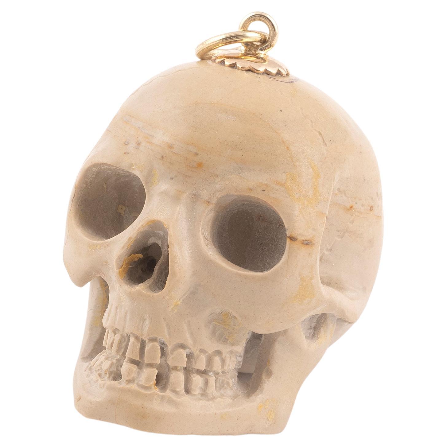 Yellow Gold and Lava Skull Pendant For Sale