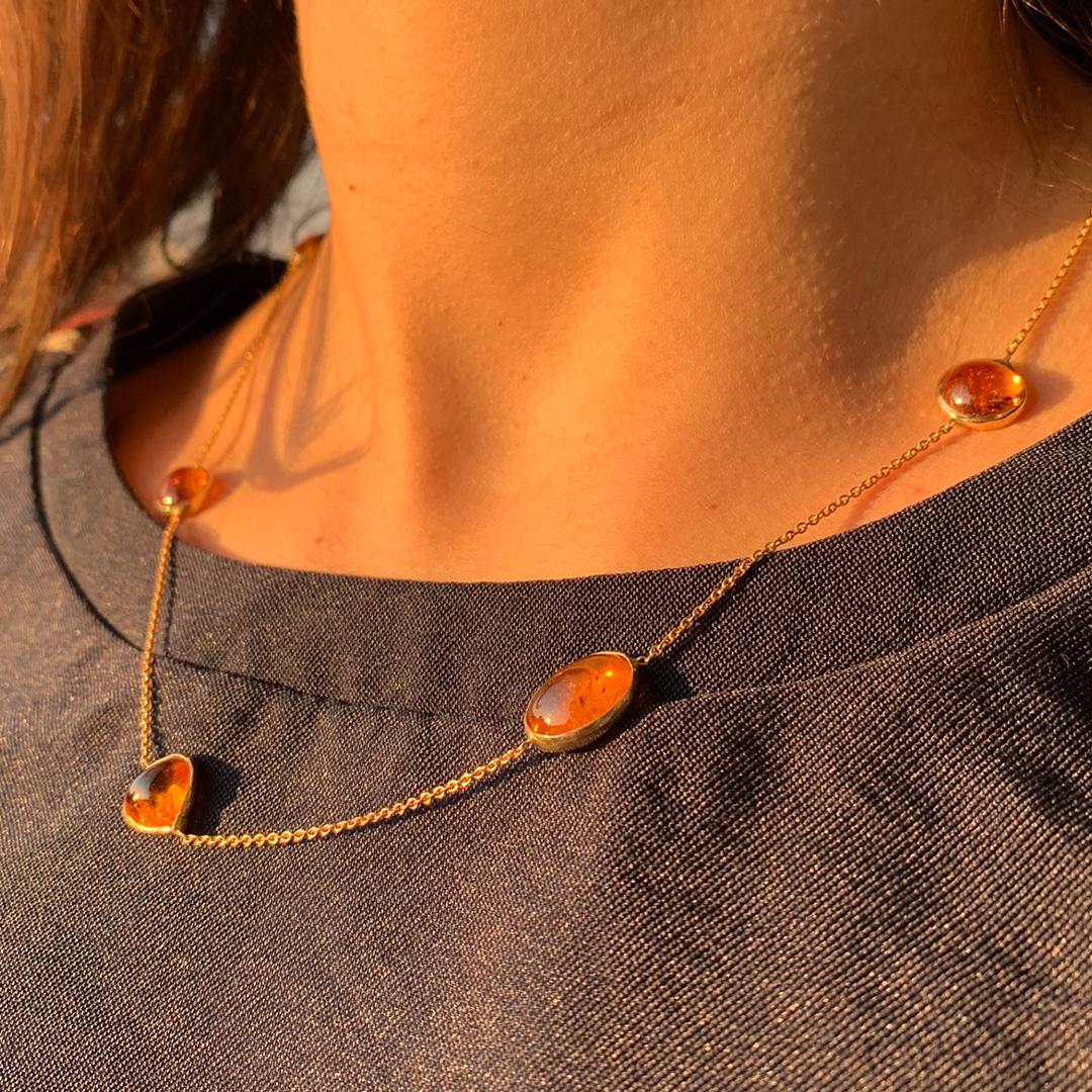 A beautiful harmony of colours and shapes for these charming necklace made of seven hessnite garnet cabochons set on 18K yellow gold chain.
Created by Marion Jeantet
Hessonite garnet weight: 24.85 carats 
lenght 47cm
Total weight : 8,92 g
French