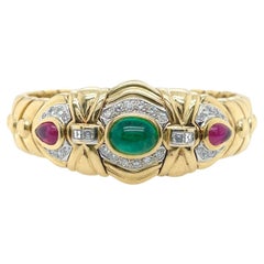 A Yellow Gold, Emerald, Ruby and Diamond Cuff Bracelet