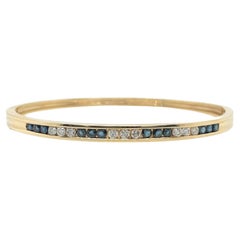 A Yellow Gold, Sapphire and Diamond Bangle Bracelet