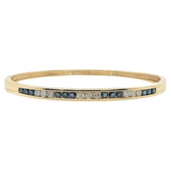 A Yellow Gold, Sapphire and Diamond Bangle Bracelet 