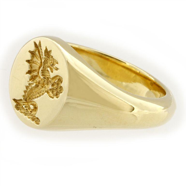 A yellow gold oval signet ring, the oval head measuring 11x 10 mm, engraved with a Dragon coat of arms, hallmarked 18ct gold, London 2006, bearing the Bentley & Skinner sponsor mark,size I 1/2, gross weight 8.25 grams.

A wonderful example of the