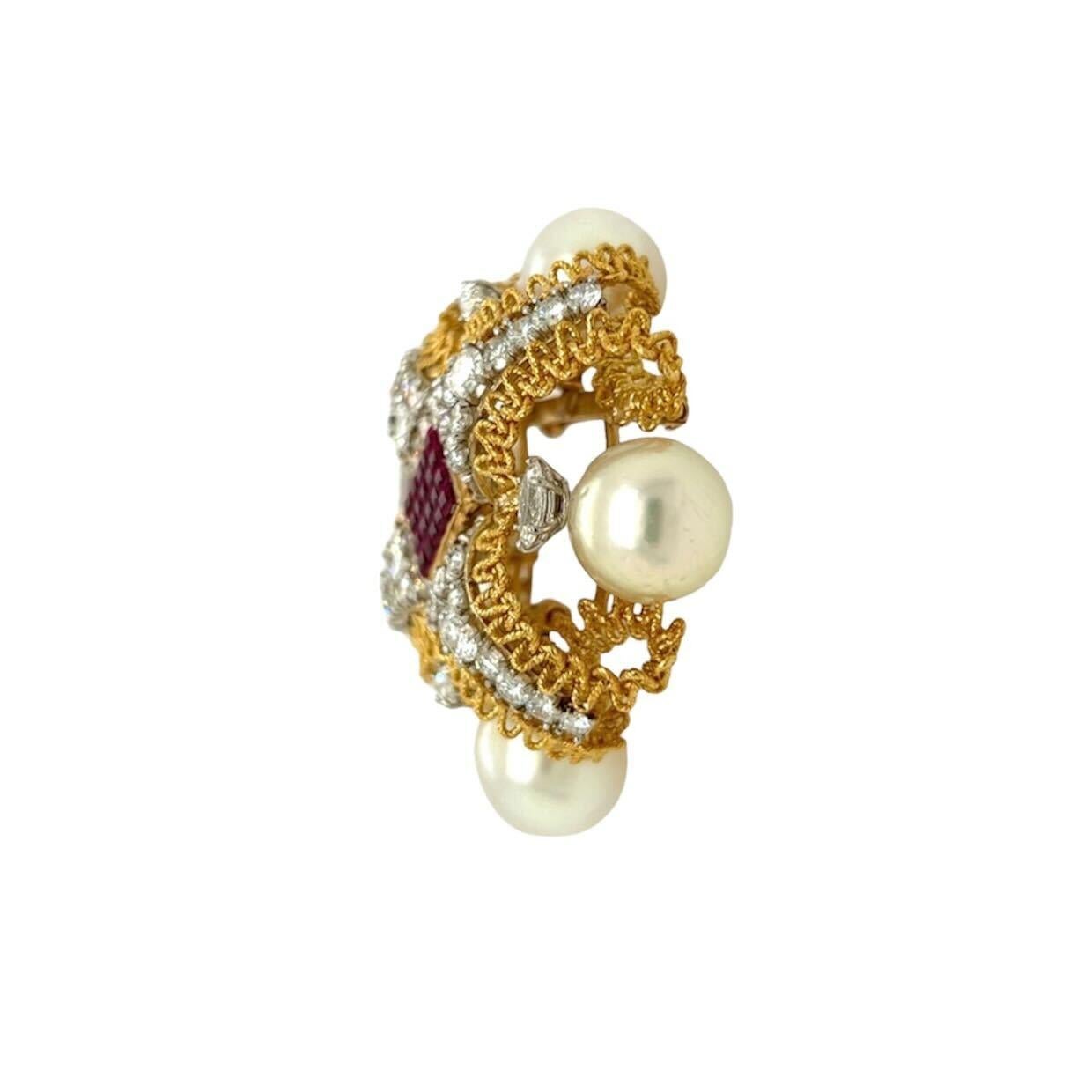 An 18 karat yellow and white gold, lab grown ruby and diamond brooch, attributed to Marc Koven.  The brooch in the shape of an X formed of intertwining ropework filigree each arm of the X with fourteen (14) white gold set round brilliant cut
