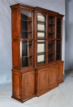 A Yew Wood and Amboyna Breakfronted Bookcase