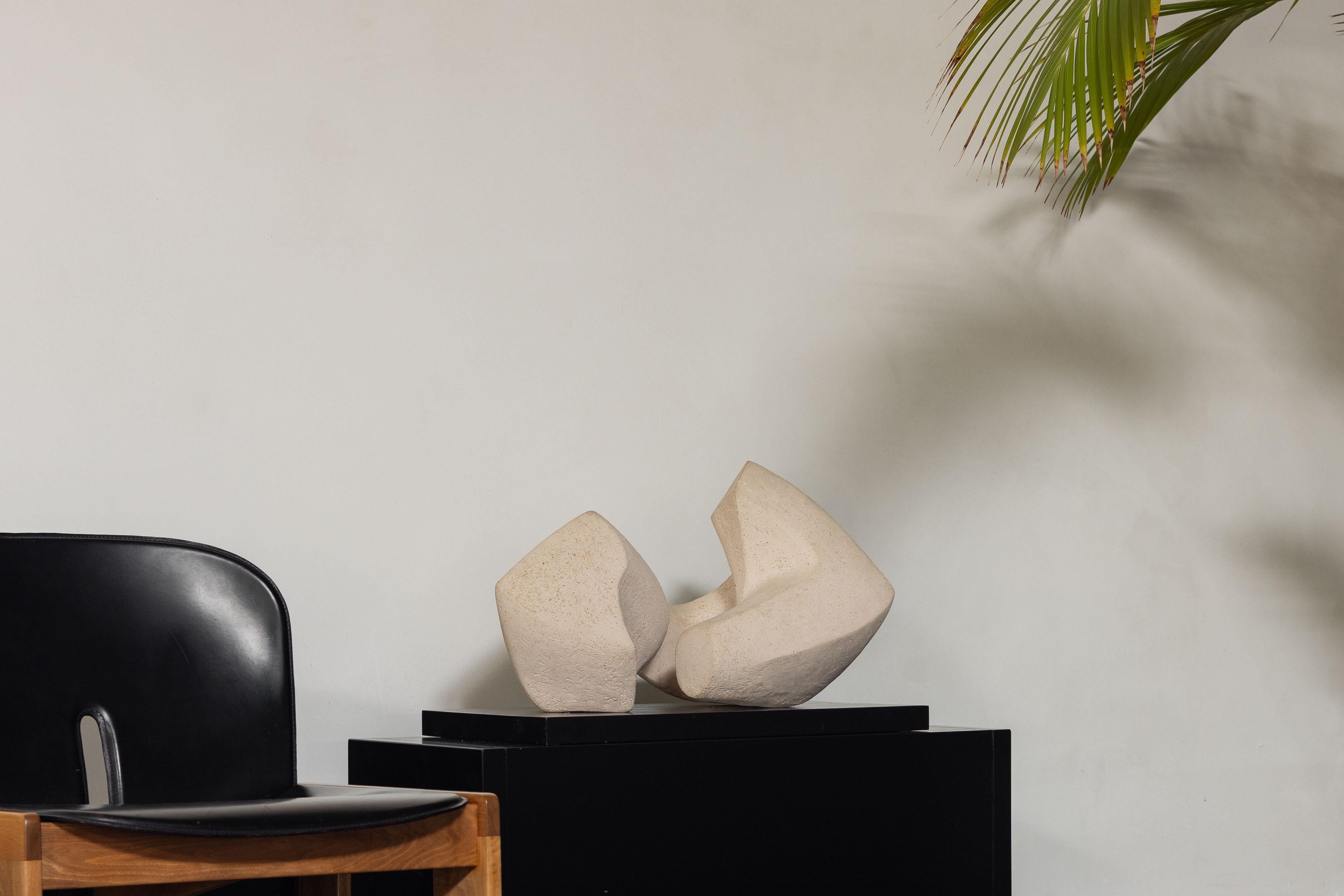 Large impressive abstract sculpture made by Anja Ysermans in the Netherlands in 1978. This off-white/beige sculpture is made of painted clay supported by a wooden base plate. The work consists of two clay pieces, hand sculpted in an organic form.