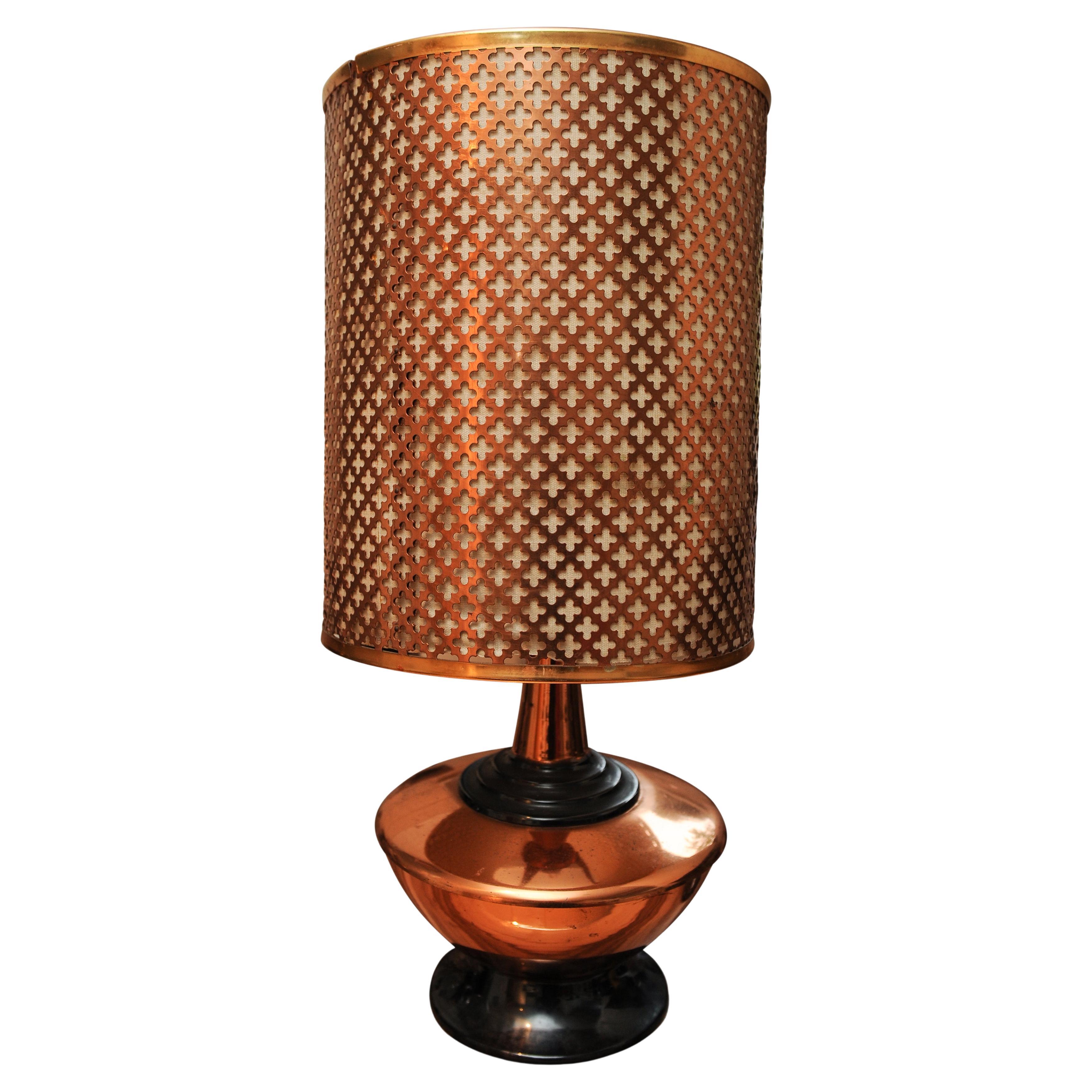 A Zambian Copper Table Lamp With A Repeating Lattice Work Pattern