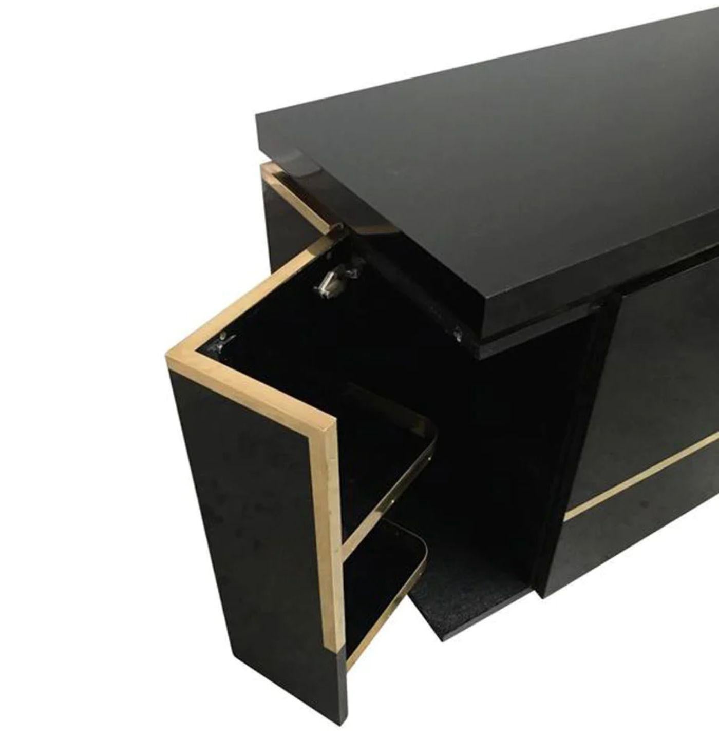 French A1970s black piano lacquer and brass sideboard by Jean Claude Mahey For Sale