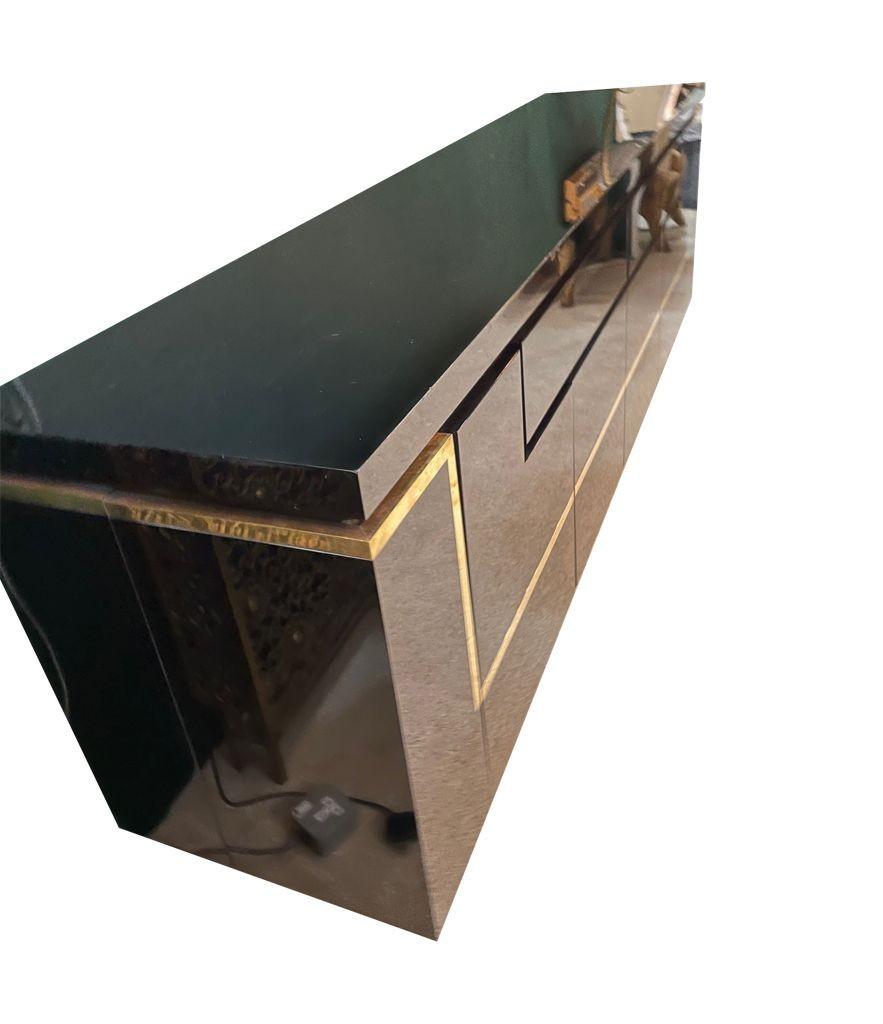 A1970s black piano lacquer and brass sideboard by Jean Claude Mahey In Good Condition For Sale In London, GB
