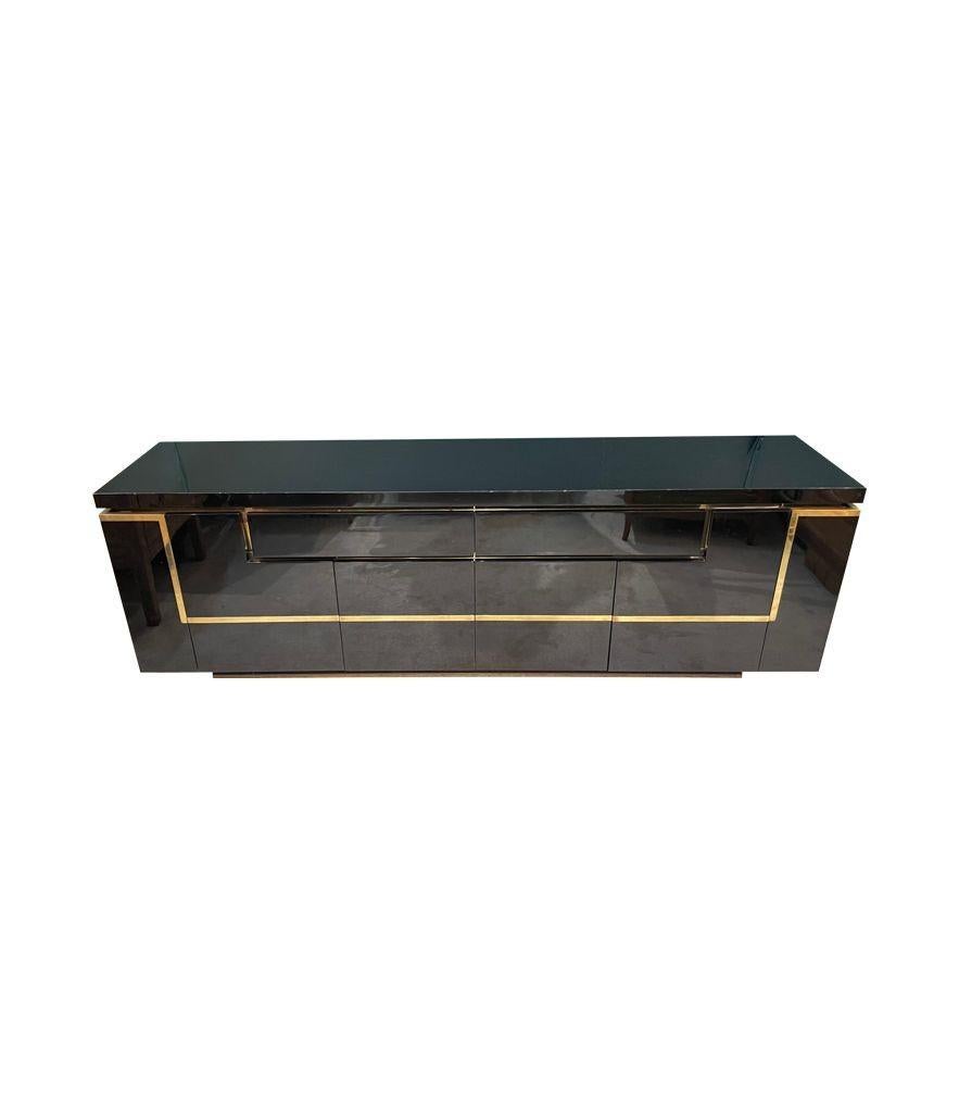 Late 20th Century A1970s black piano lacquer and brass sideboard by Jean Claude Mahey For Sale
