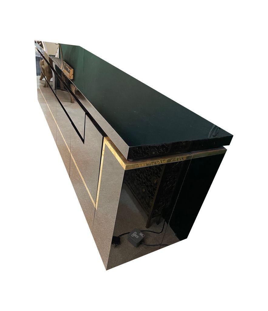 Brass A1970s black piano lacquer and brass sideboard by Jean Claude Mahey For Sale